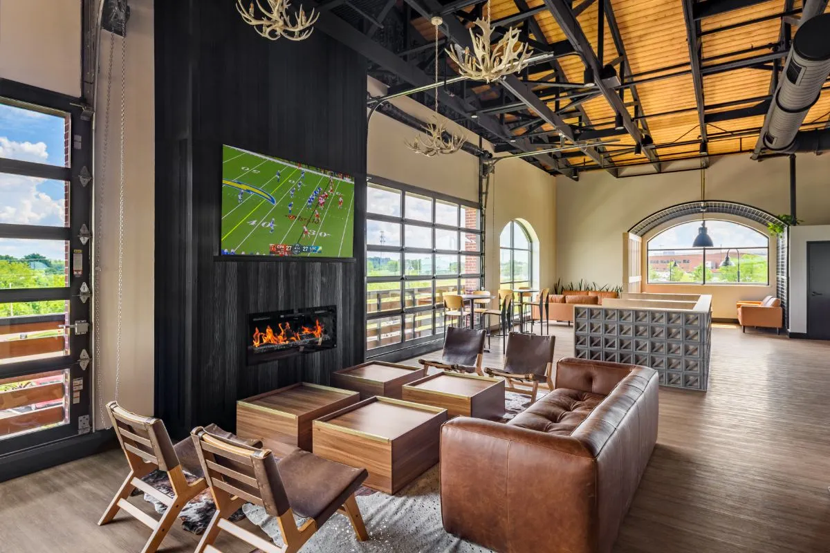 Liberty Collective interior with LED screen, mezzanine seating and two-level dining area